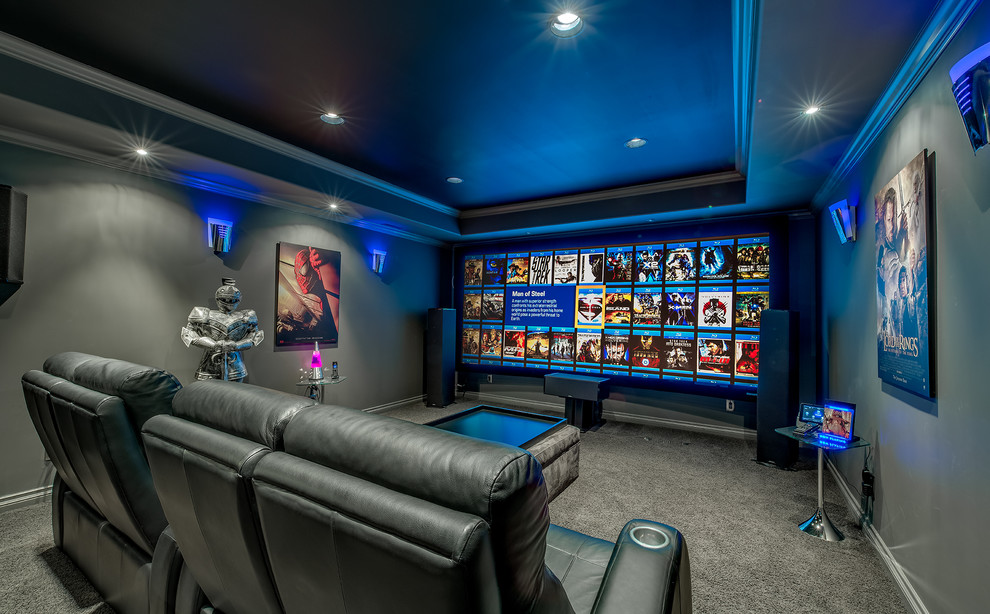 Large contemporary enclosed home theatre in Calgary with grey walls, carpet, a projector screen and grey floor.