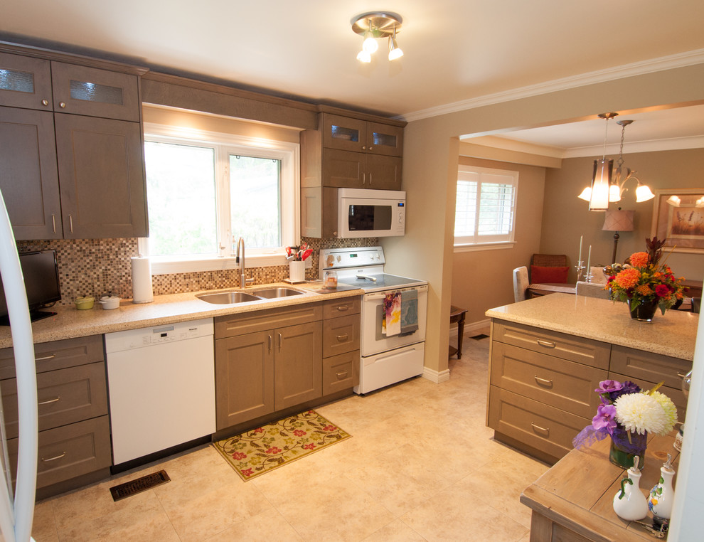Eat-in kitchen - mid-sized transitional u-shaped vinyl floor and beige floor eat-in kitchen idea in Toronto with a double-bowl sink, shaker cabinets, distressed cabinets, quartzite countertops, multicolored backsplash, mosaic tile backsplash, white appliances and a peninsula