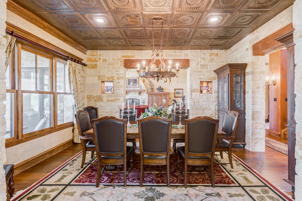 Design ideas for a country dining room in Dallas with white walls, medium hardwood floors and brown floor.