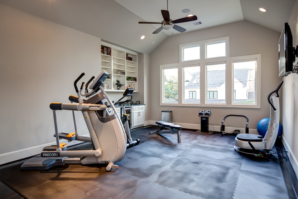 This is an example of a transitional home gym in Houston with white walls.
