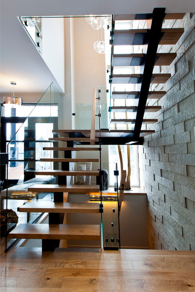 Inspiration for a mid-sized modern wood floating staircase in Montreal with open risers.