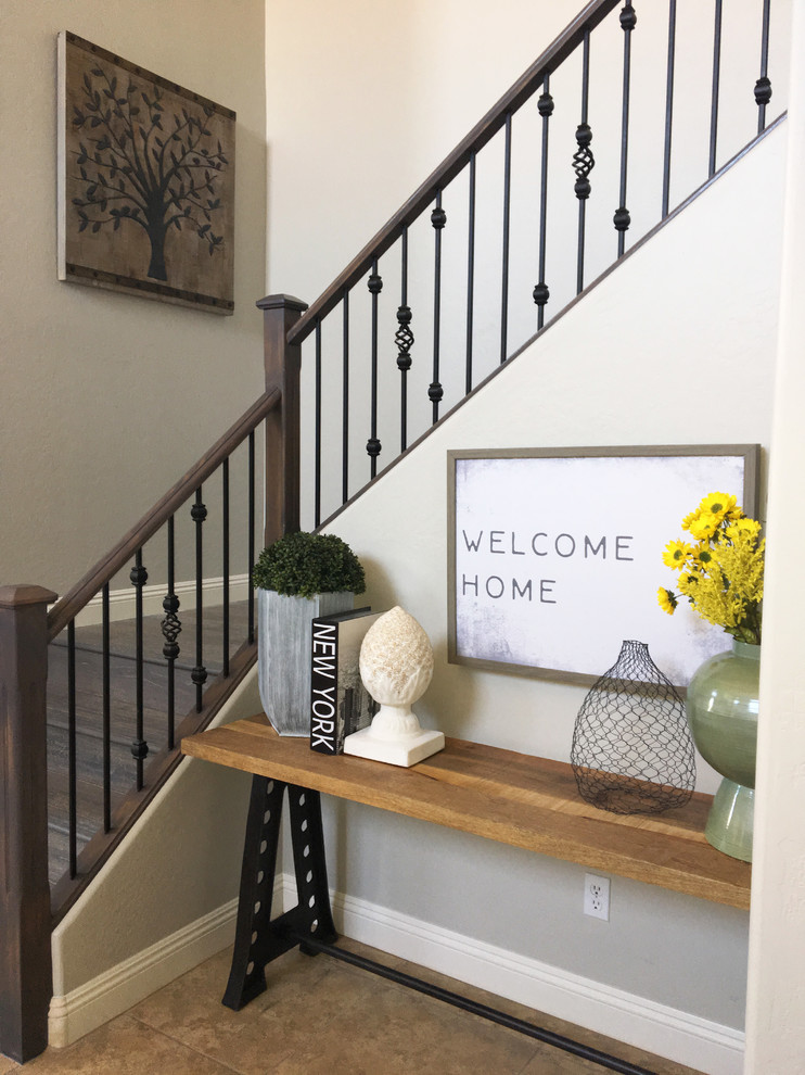 Mid-sized mountain style foyer photo in Phoenix with gray walls