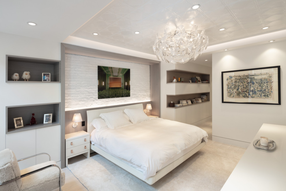 Contemporary bedroom in New York with white walls and grey floor.