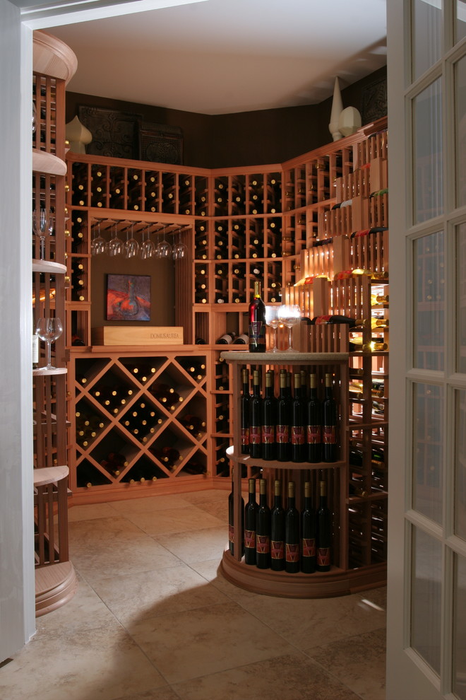 This is an example of a mid-sized traditional wine cellar in Indianapolis with diamond bins, porcelain floors and beige floor.