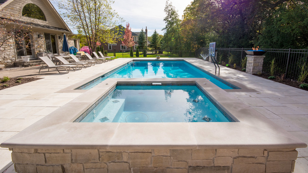Inspiration for a large rustic backyard concrete paver and rectangular lap pool remodel in Chicago