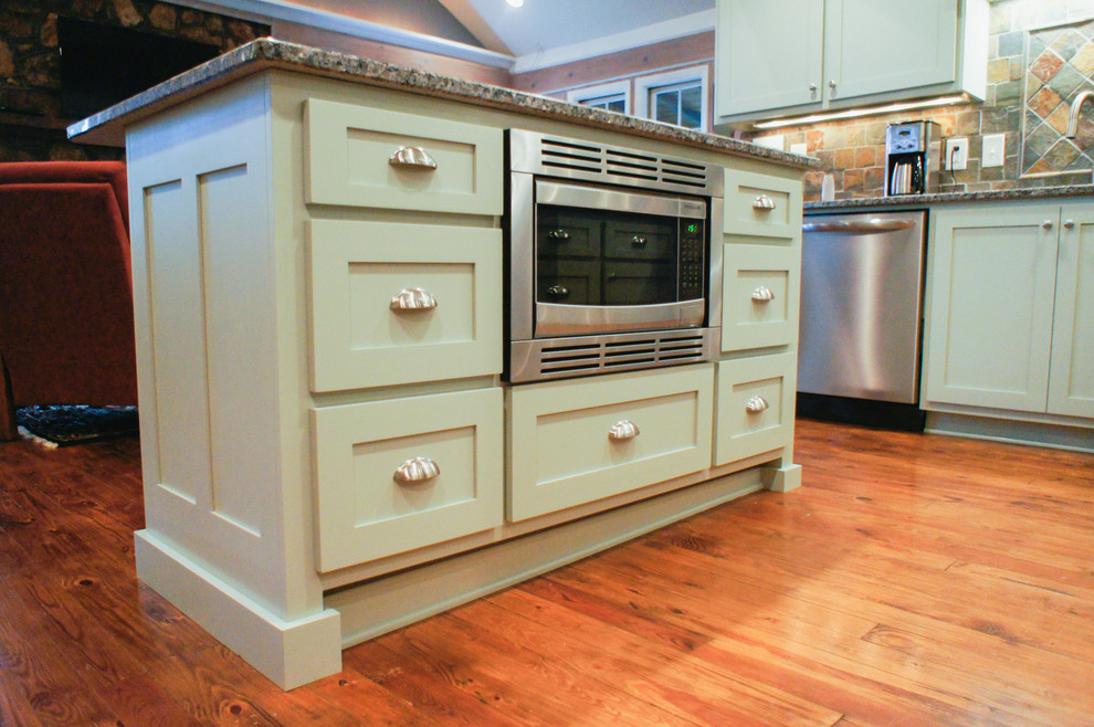 Photo of an arts and crafts kitchen in Atlanta with shaker cabinets and green cabinets.