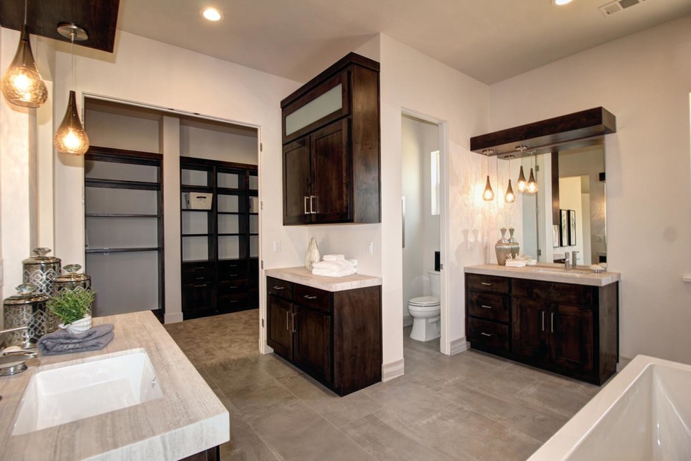 Design ideas for a mid-sized contemporary master bathroom in Sacramento with a drop-in sink, shaker cabinets, dark wood cabinets, quartzite benchtops, a freestanding tub, a double shower, a two-piece toilet, gray tile, ceramic tile, beige walls and ceramic floors.