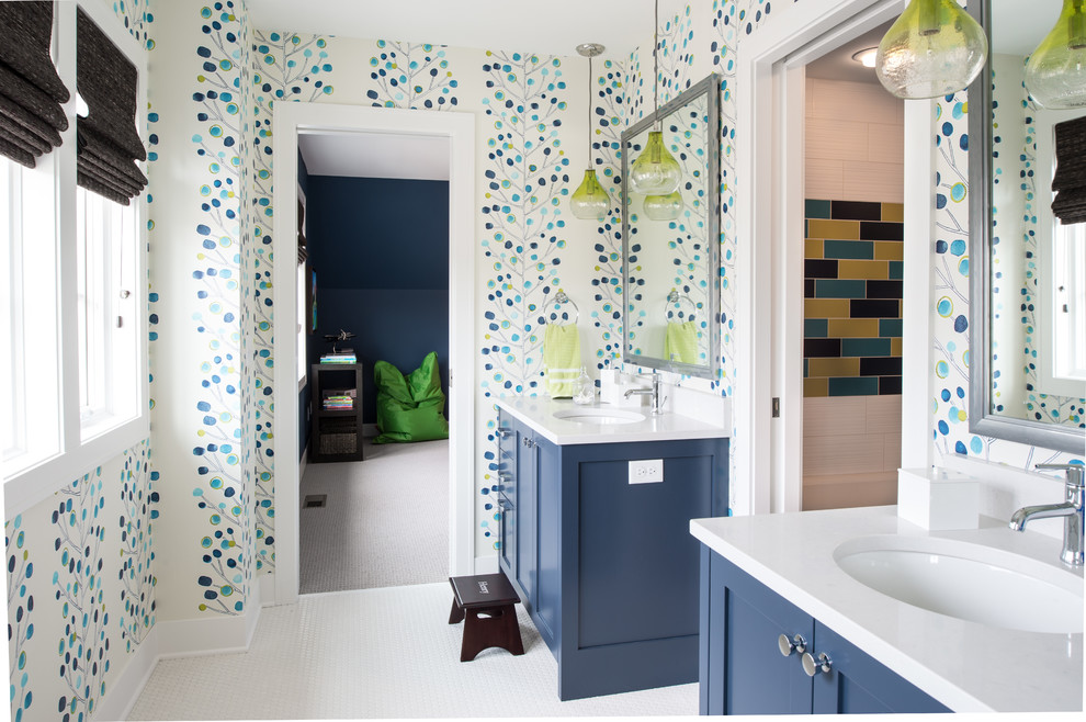 Design ideas for a transitional bathroom in Minneapolis with an undermount sink, shaker cabinets, blue cabinets, multi-coloured walls and mosaic tile floors.