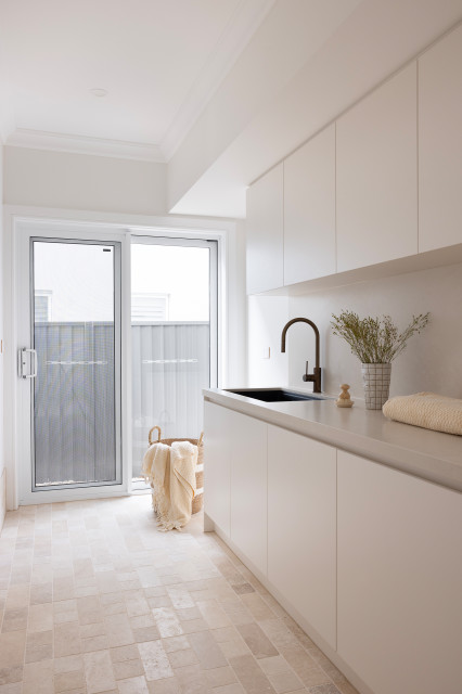 Showcase Home contemporary-utility-room