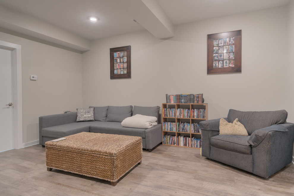 Small modern walk-out basement in Other with grey walls, vinyl floors and brown floor.