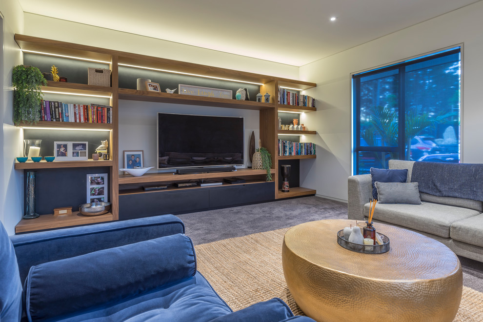 Photo of a Large modern Formal Enclosed living room in Auckland With White Walls, Carpet, a Freestanding TV and Grey Floor.