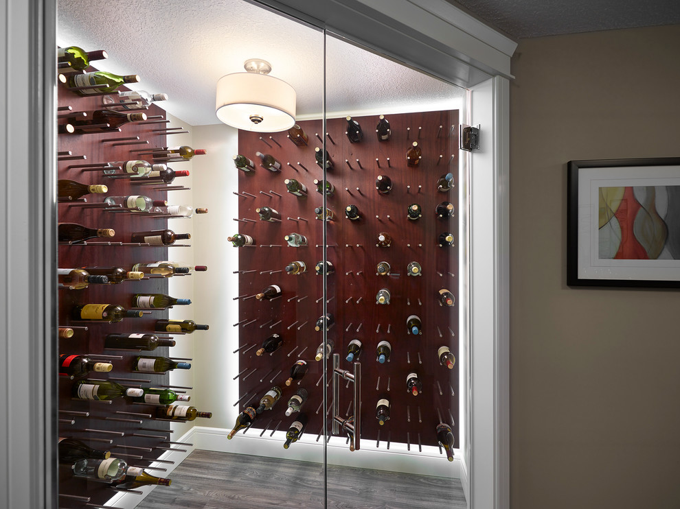 Inspiration for a transitional wine cellar in Edmonton with grey floor.