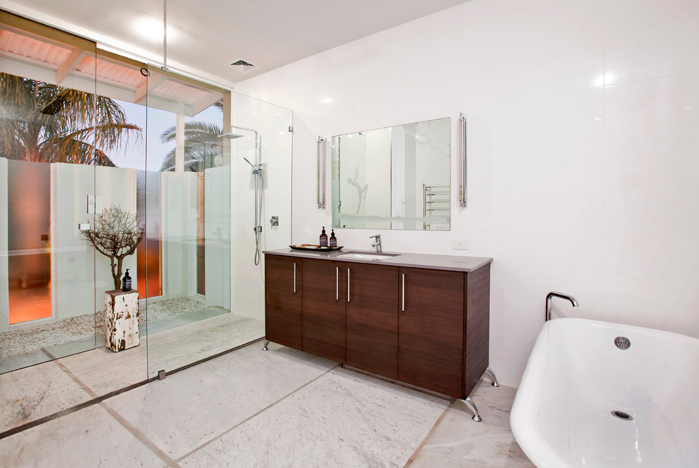 This is an example of a contemporary bathroom in Adelaide with a freestanding tub and an undermount sink.