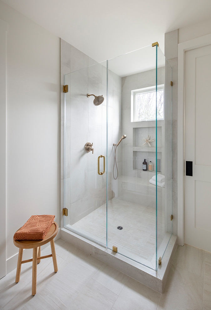 This is an example of a mid-sized country master bathroom in San Francisco with shaker cabinets, white cabinets, an alcove shower, a one-piece toilet, white tile, ceramic tile, white walls, porcelain floors, an undermount sink, engineered quartz benchtops, white floor, a hinged shower door, white benchtops, a niche, a double vanity and a built-in vanity.
