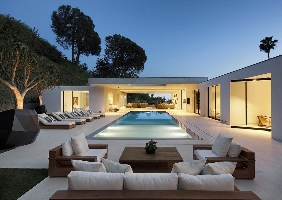 Inspiration for a contemporary rectangular pool in Los Angeles with concrete slab.
