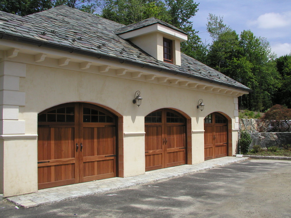 This is an example of an expansive mediterranean attached three-car carport in New York.
