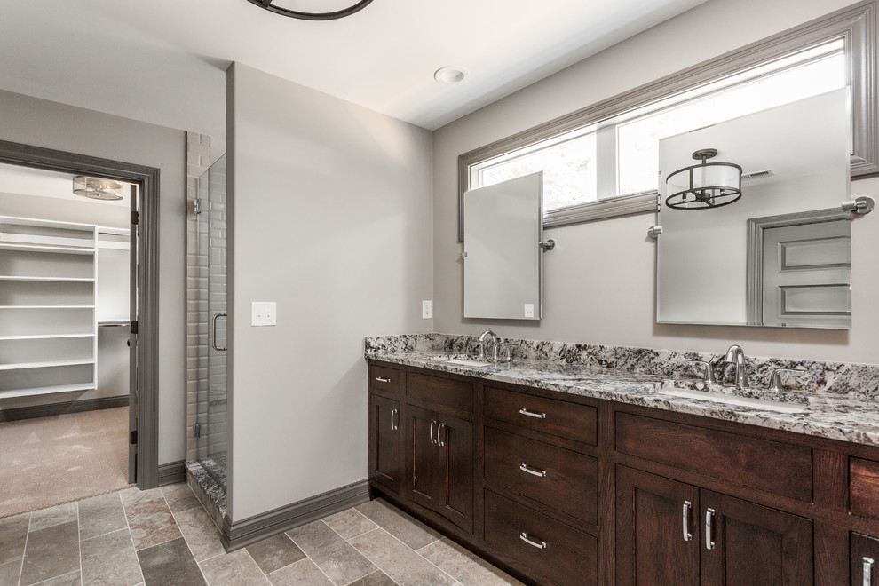 Inspiration for a large modern master bathroom in Indianapolis with dark wood cabinets.