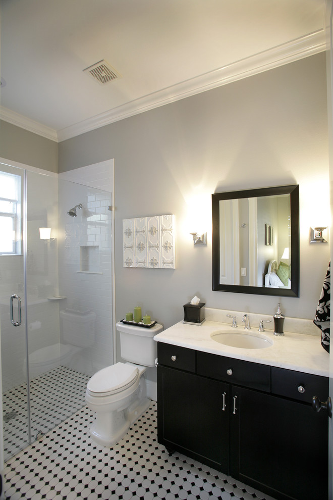 This is an example of a contemporary bathroom in Tampa with a curbless shower and subway tile.