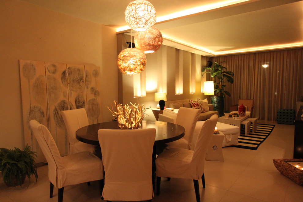 This is an example of a beach style dining room in Other.