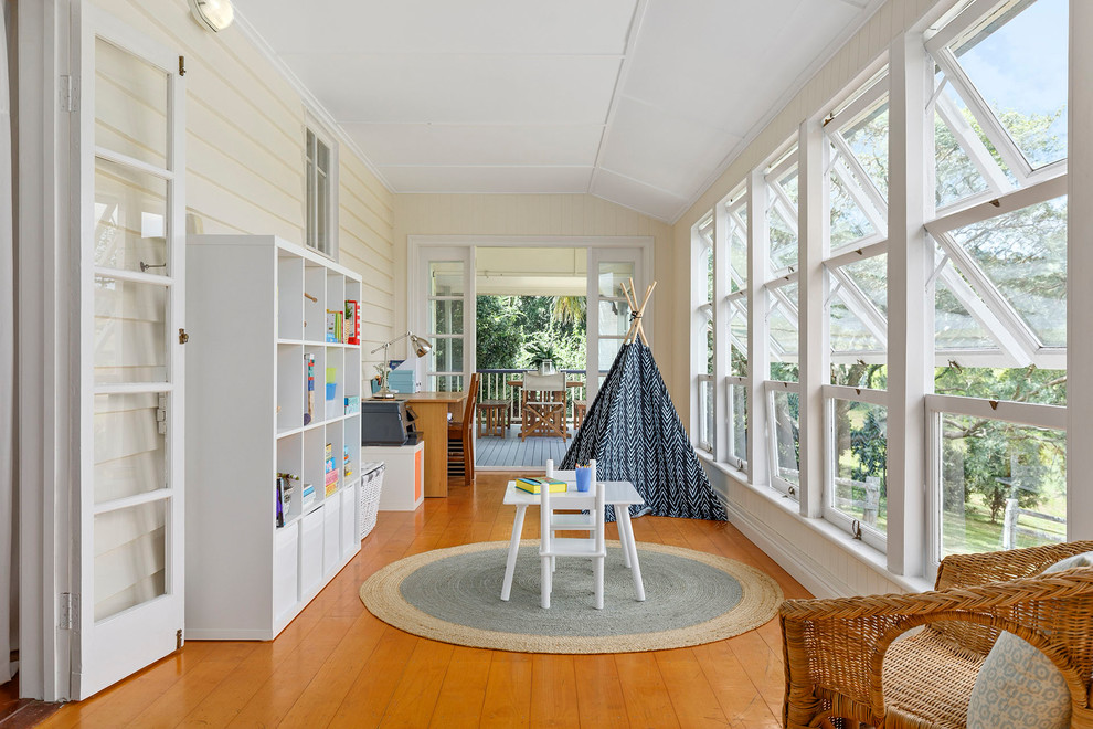 Design ideas for a country sunroom in Brisbane with medium hardwood floors, a standard ceiling and brown floor.