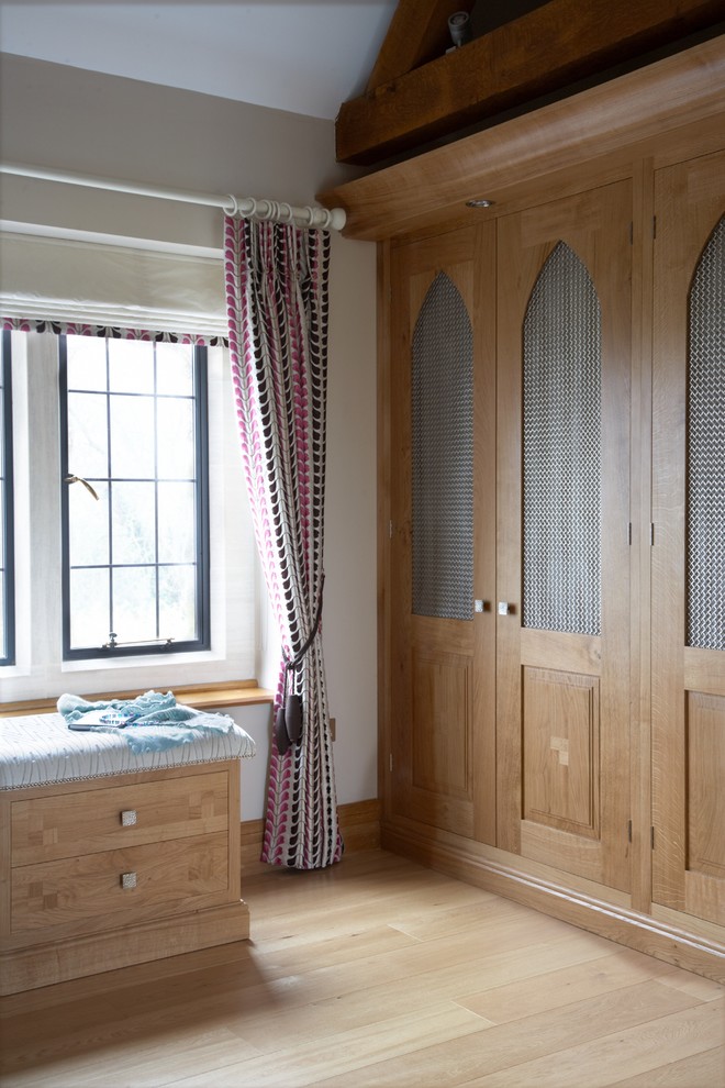 This is an example of a large modern storage and wardrobe in West Midlands.