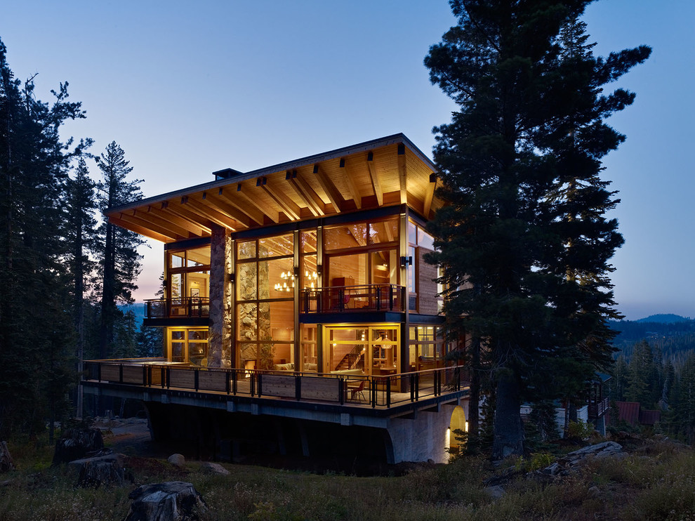 Inspiration for a country two-storey exterior in Sacramento with wood siding and a shed roof.