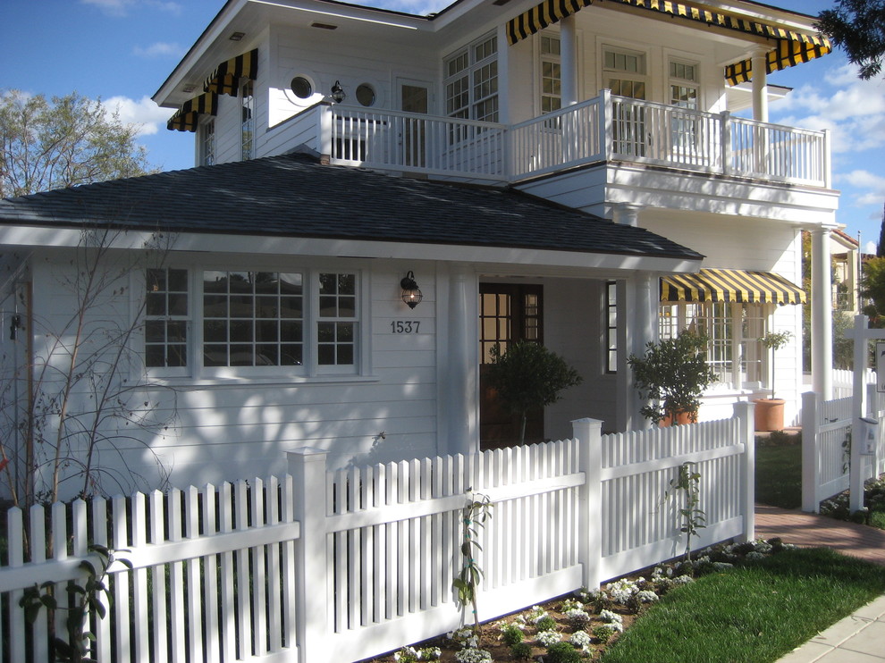 This is an example of a traditional two-storey white exterior in San Diego with wood siding.
