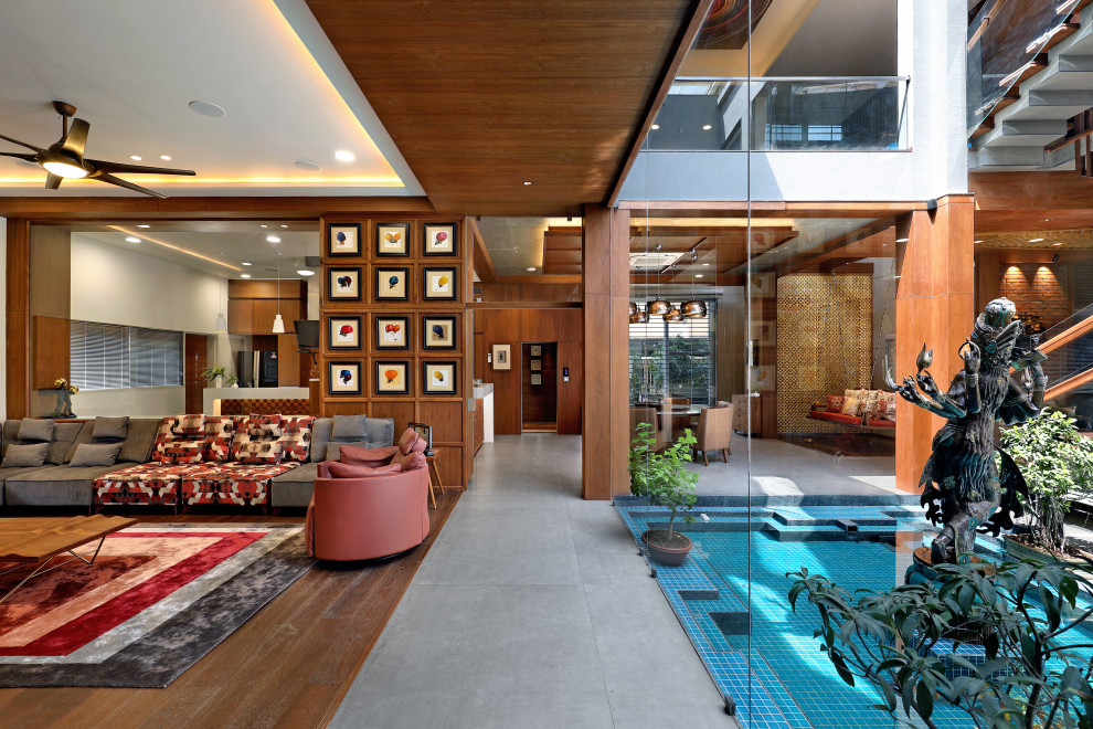 This is an example of a contemporary living room in Ahmedabad.