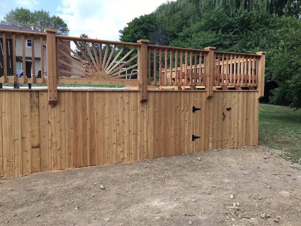 Deck - large transitional backyard deck idea in Milwaukee