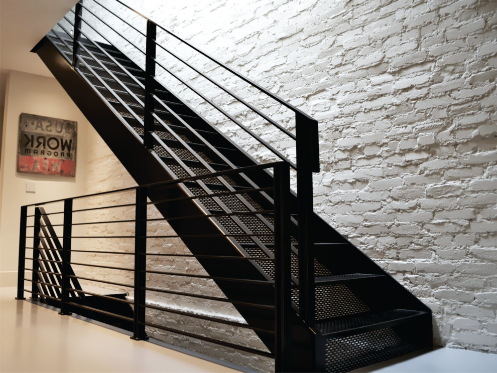 This is an example of a mid-sized midcentury staircase in Toronto with brick walls.