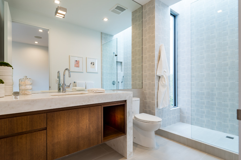 Inspiration for a contemporary 3/4 bathroom in Los Angeles with flat-panel cabinets, dark wood cabinets, an alcove shower, an undermount sink, grey floor, an open shower and white benchtops.