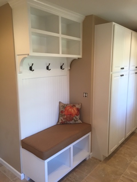 Utility room - mid-sized transitional u-shaped ceramic tile utility room idea in Phoenix with raised-panel cabinets, white cabinets, granite countertops, a side-by-side washer/dryer, an undermount sink and beige walls