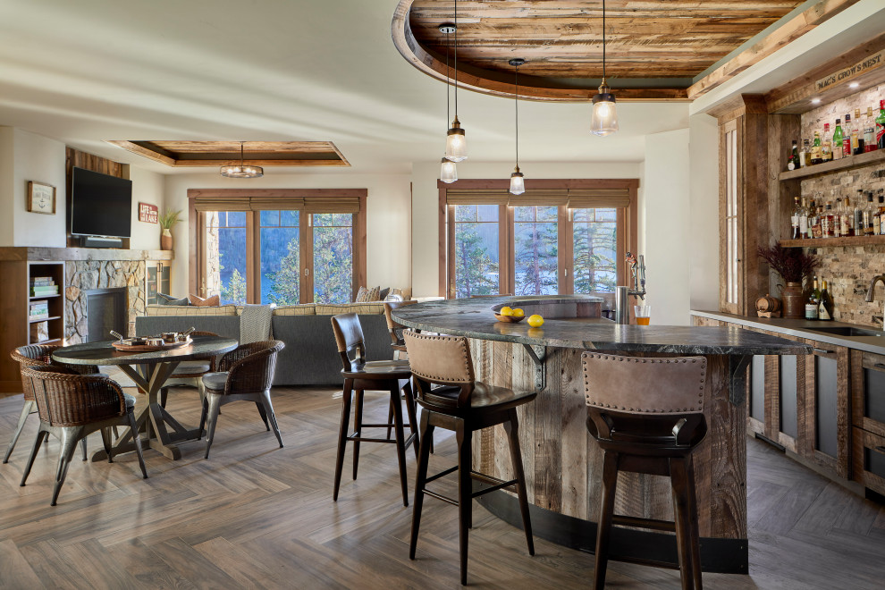 This is an example of a large rustic home bar in Denver with porcelain flooring and brown floors.
