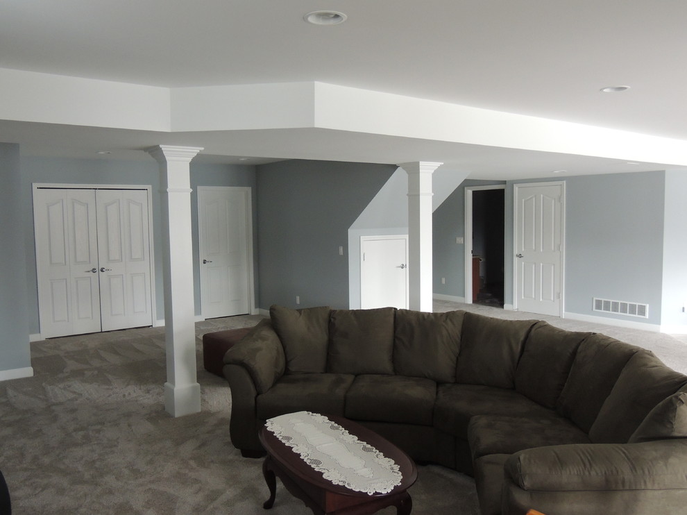 Inspiration for a mid-sized traditional look-out basement in Detroit with grey walls, carpet and no fireplace.