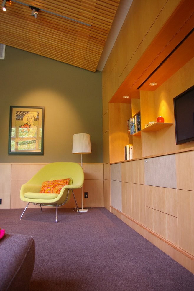 Photo of a contemporary family room in San Francisco with green walls, carpet, a wall-mounted tv and purple floor.