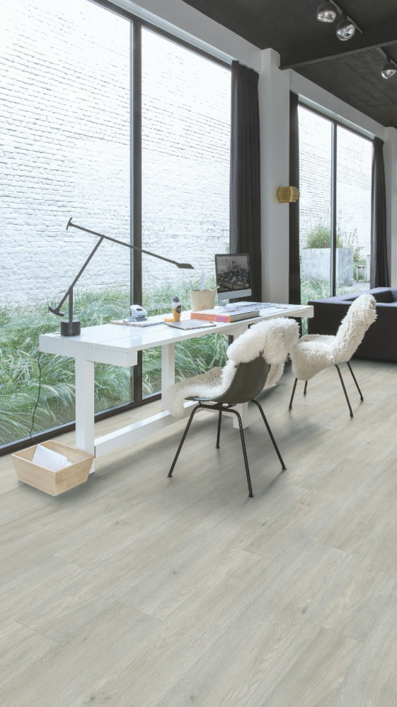 This is an example of a modern home office in Other with vinyl floors and grey floor.