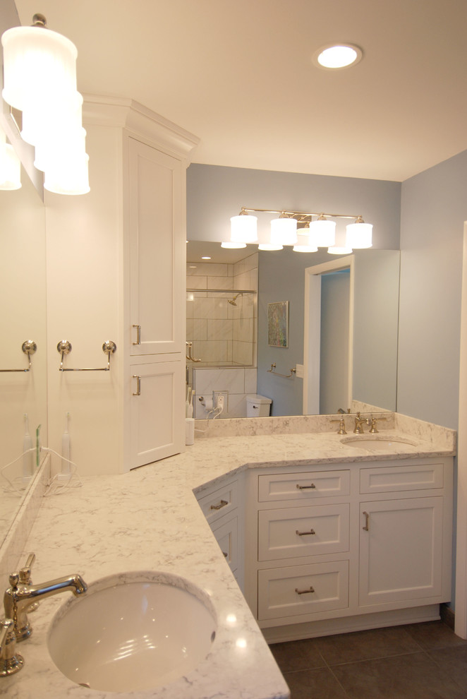 Inspiration for a mid-sized transitional master bathroom in Milwaukee with beaded inset cabinets, white cabinets, a curbless shower, a two-piece toilet, white tile, ceramic tile, blue walls, porcelain floors, an undermount sink and engineered quartz benchtops.
