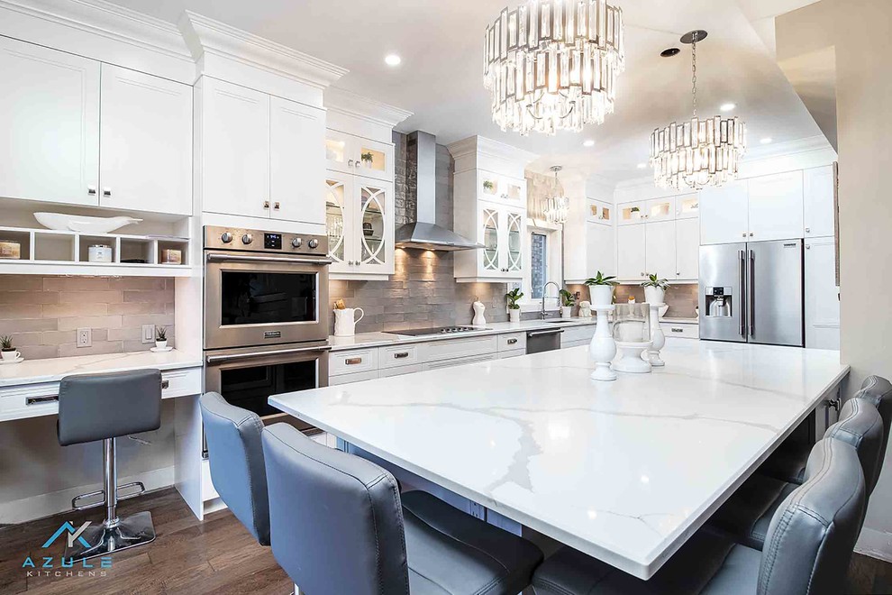 Inspiration for a large transitional l-shaped eat-in kitchen remodel with recessed-panel cabinets, white cabinets, quartz countertops, an island and white countertops