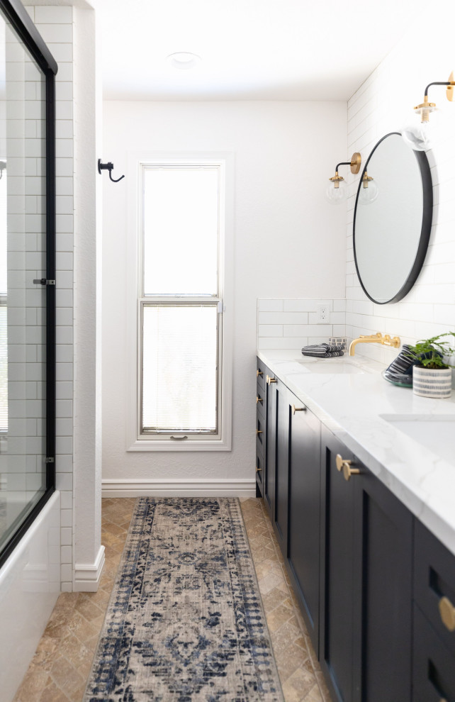 Example of a mid-sized cottage 3/4 white tile and subway tile brown floor, double-sink and travertine floor alcove bathtub design in Phoenix with shaker cabinets, white walls, an undermount sink, white countertops, a built-in vanity, blue cabinets, a one-piece toilet and quartz countertops