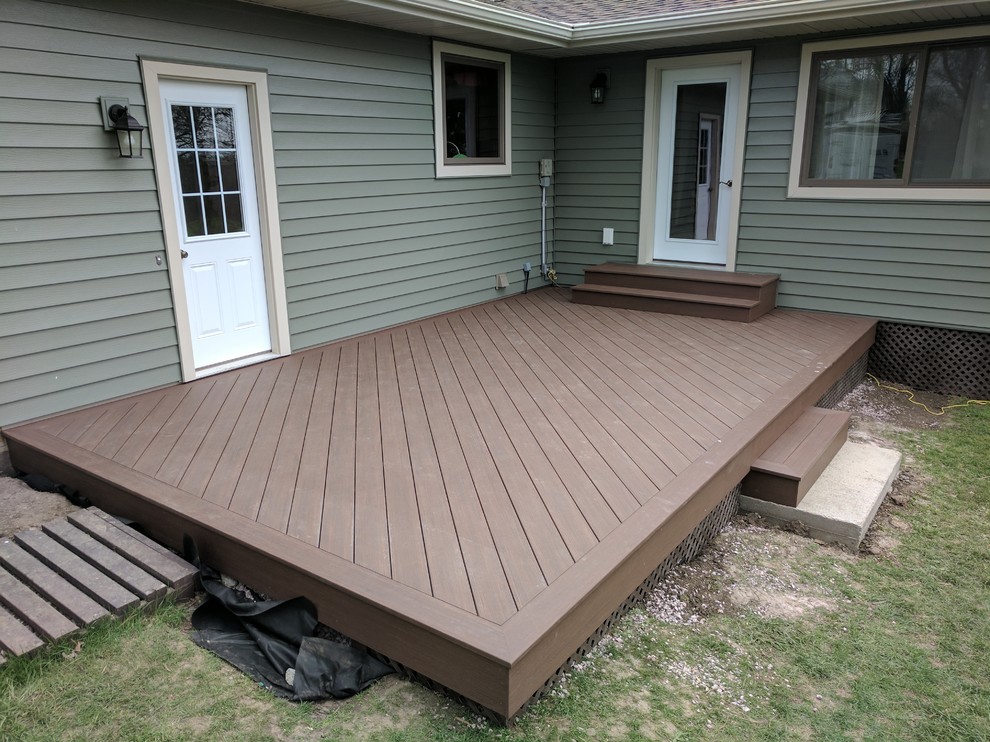 Photo of a mid-sized traditional backyard deck in Other with no cover.