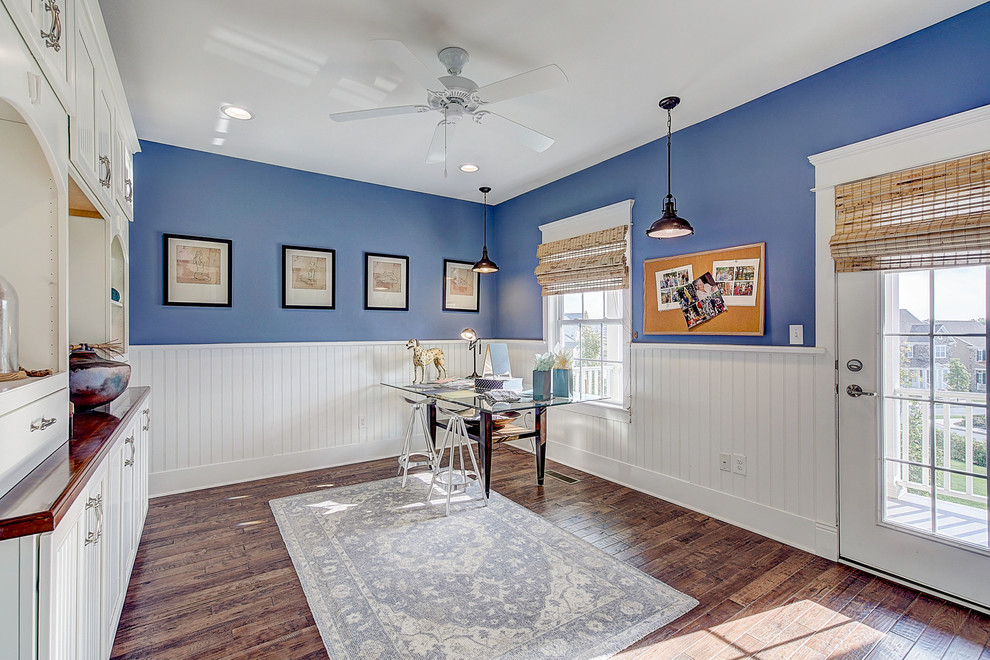 Inspiration for a large arts and crafts craft room in Philadelphia with blue walls, medium hardwood floors, a freestanding desk, brown floor and decorative wall panelling.