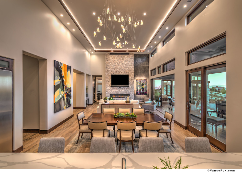 This is an example of a large contemporary open concept living room in Other with beige walls, ceramic floors, a ribbon fireplace, a stone fireplace surround, a wall-mounted tv and recessed.