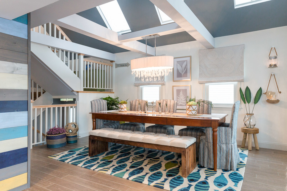 Mid-sized beach style medium tone wood floor kitchen/dining room combo photo in Boston with white walls and no fireplace