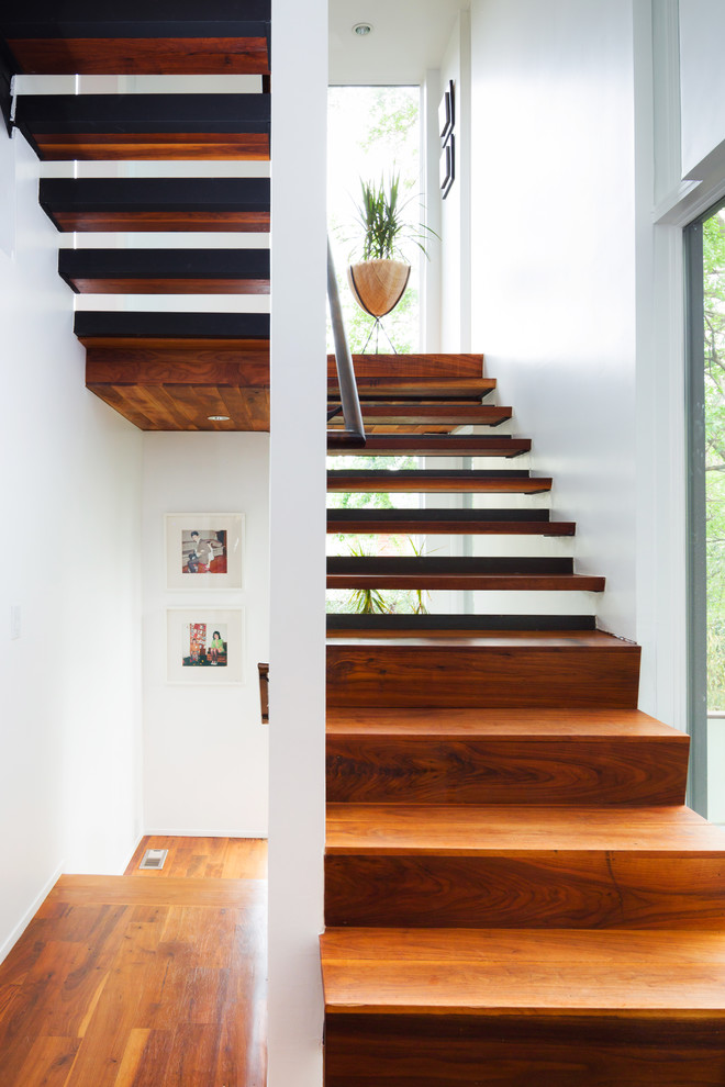 Design ideas for a contemporary wood u-shaped staircase in Atlanta with open risers.