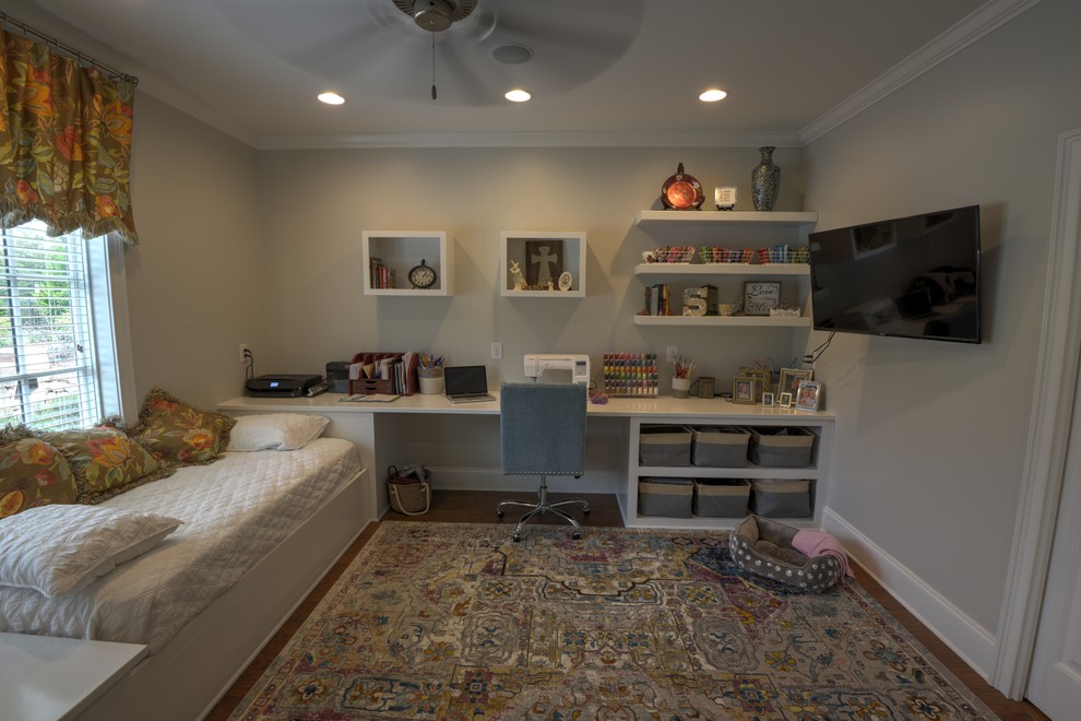 Large traditional craft room in Atlanta with grey walls, dark hardwood floors and a built-in desk.