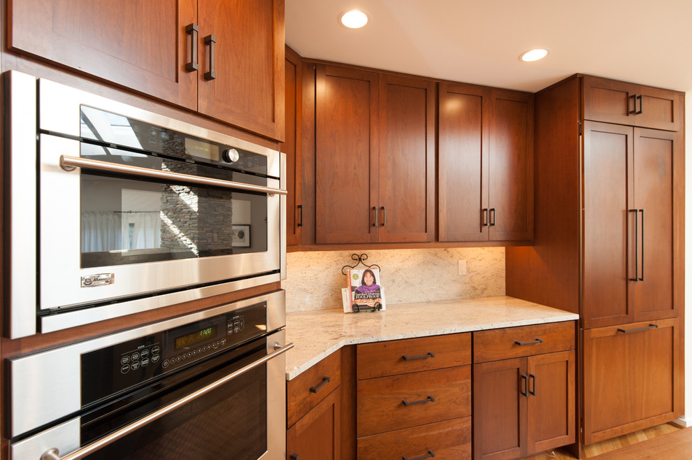 Large transitional kitchen photo in DC Metro with an undermount sink, shaker cabinets, granite countertops, stainless steel appliances and an island