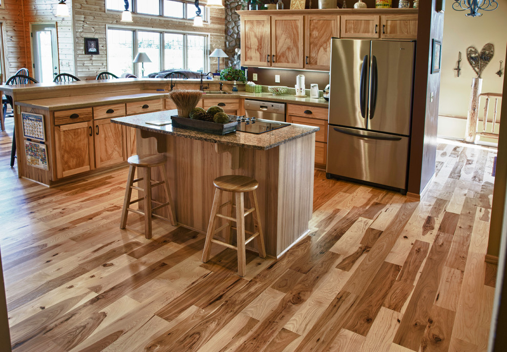 Inspiration for a mid-sized rustic light wood floor eat-in kitchen remodel