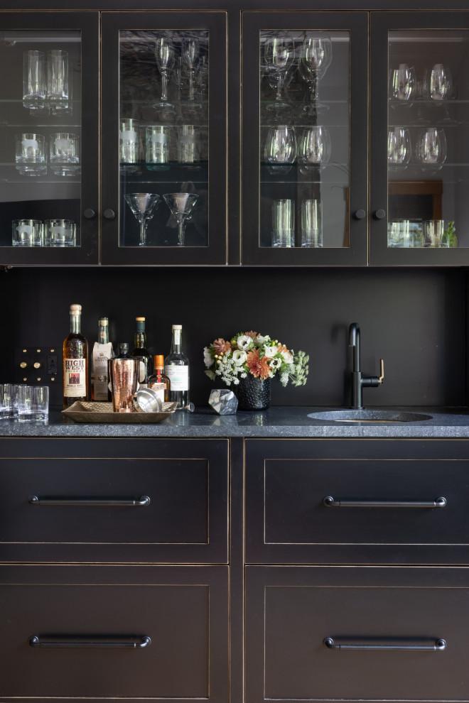 Design ideas for a large contemporary home bar in Denver with an undermount sink, shaker cabinets, black cabinets, soapstone benchtops and black benchtop.