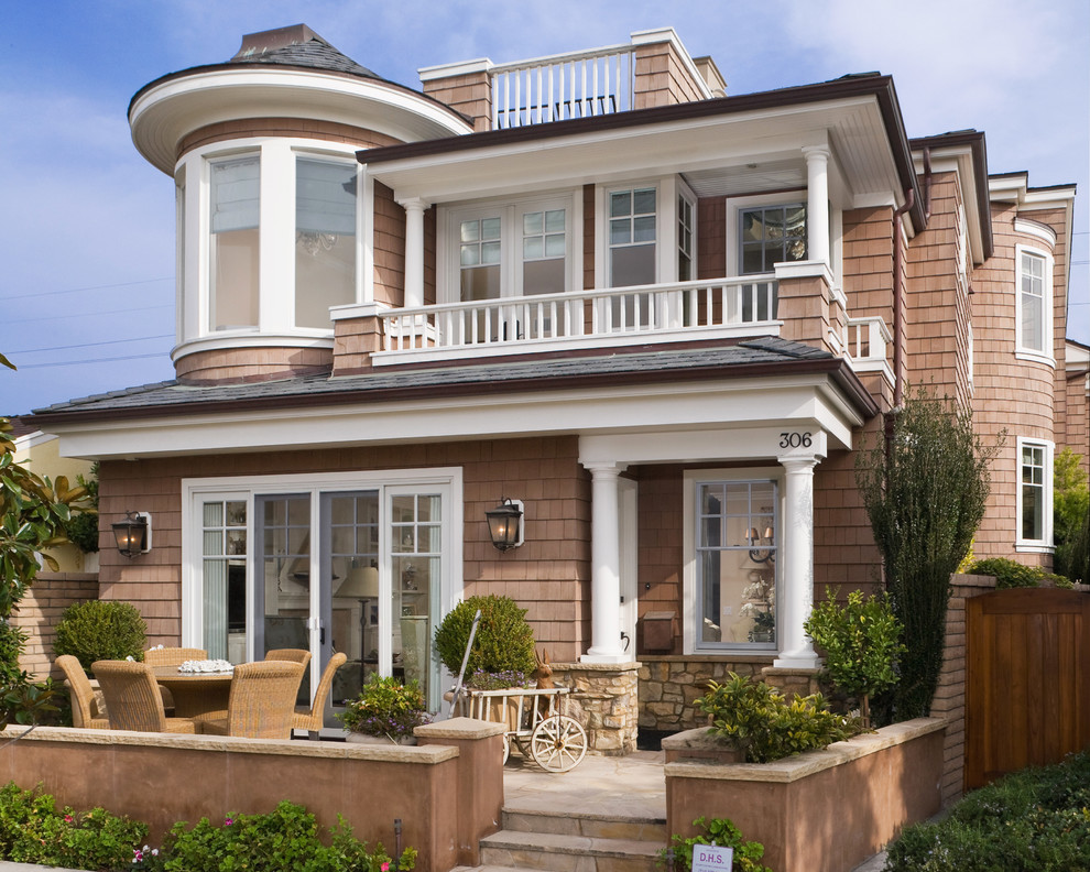 Design ideas for a mid-sized beach style two-storey exterior in Orange County.