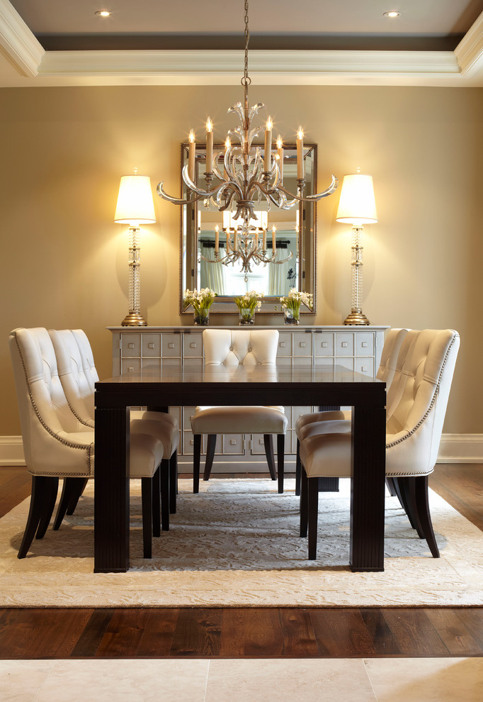 Design ideas for a large transitional separate dining room in Toronto with beige walls and dark hardwood floors.